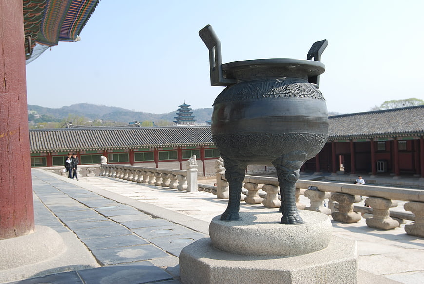 Traditional Korean bronze incense burner in palace courtyard