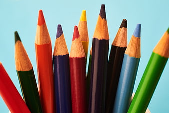 Close-up of colorful pencils on blue background