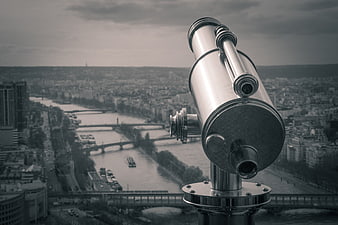 Vintage Telescope Overlooking Paris Cityscape and River