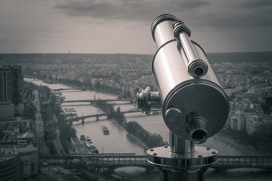 Vintage Telescope Overlooking Paris Cityscape and River