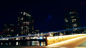 Night Cityscape with Light Trails on Bridge and Waterfront