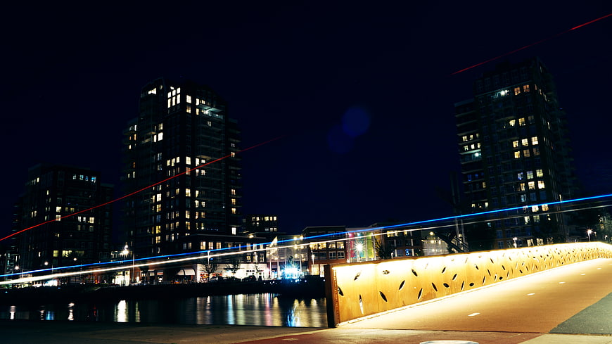 Night Cityscape with Light Trails on Bridge and Waterfront