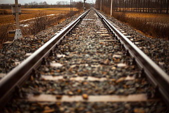 Low Angle View of Railway Tracks in Rural Winter Landscape