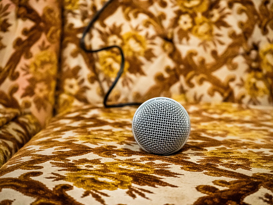 Silver Microphone on Vintage Patterned Couch