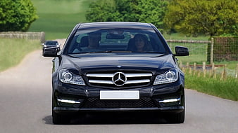 Black Mercedes-Benz C-Class Driving on Country Road