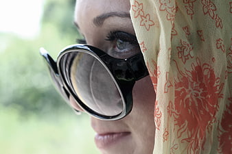 Close-up of Woman Wearing Sunglasses and Floral Scarf