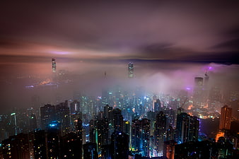 Misty Hong Kong Skyline at Night with Purple Clouds