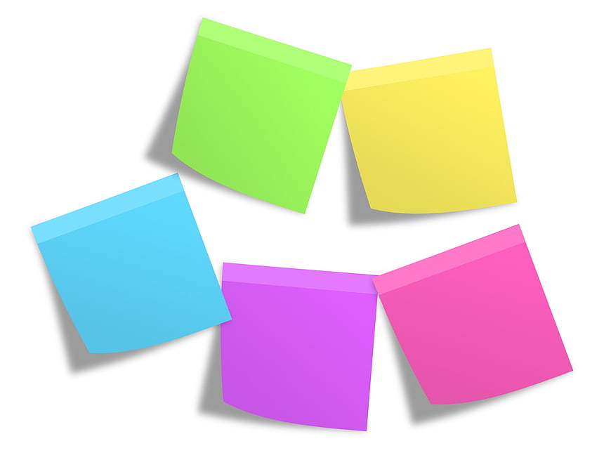 Colorful sticky notes arranged in a circle on white background