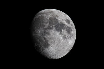 Detailed Waxing Gibbous Moon Surface Against Black Sky