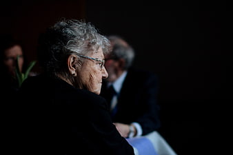 Senior Woman in Profile at Formal Event