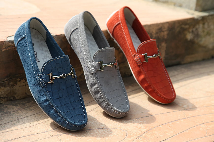 Three Colorful Crocodile Texture Horsebit Loafers on Stone Steps