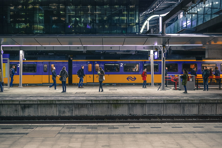 Passengers waiting on platform at modern Dutch train station