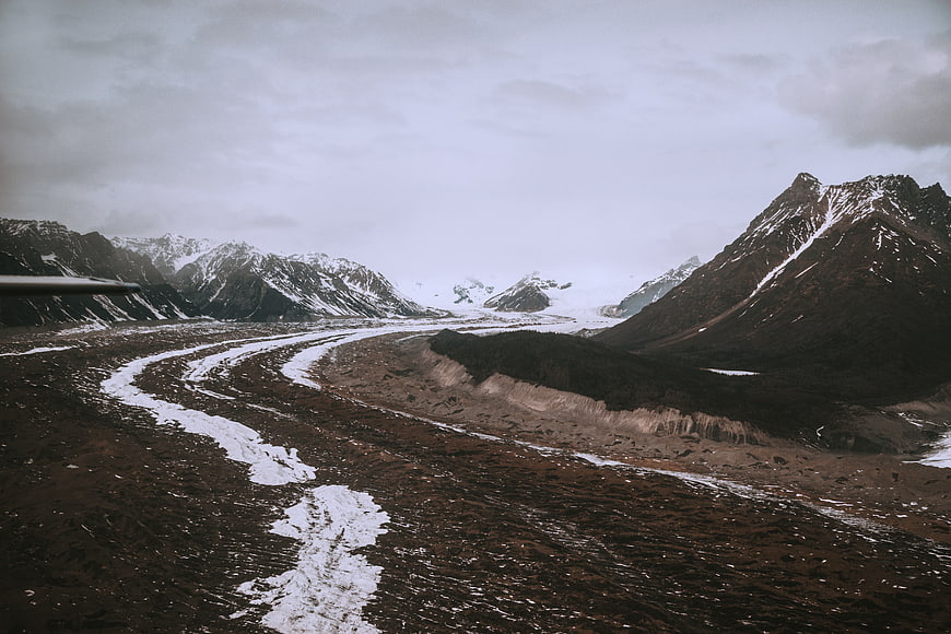 Aerial View of Snow-Capped Mountains and Glacier Valley