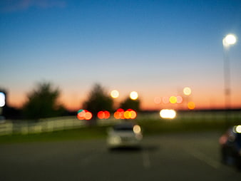 Abstract Blurred Sunset Bokeh Background with Car Lights