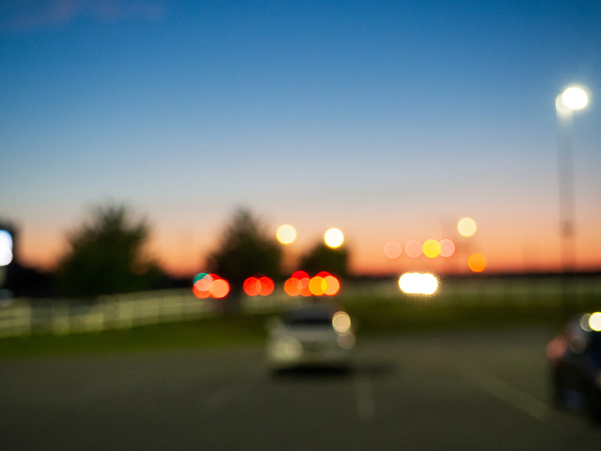 Abstract Blurred Sunset Bokeh Background with Car Lights