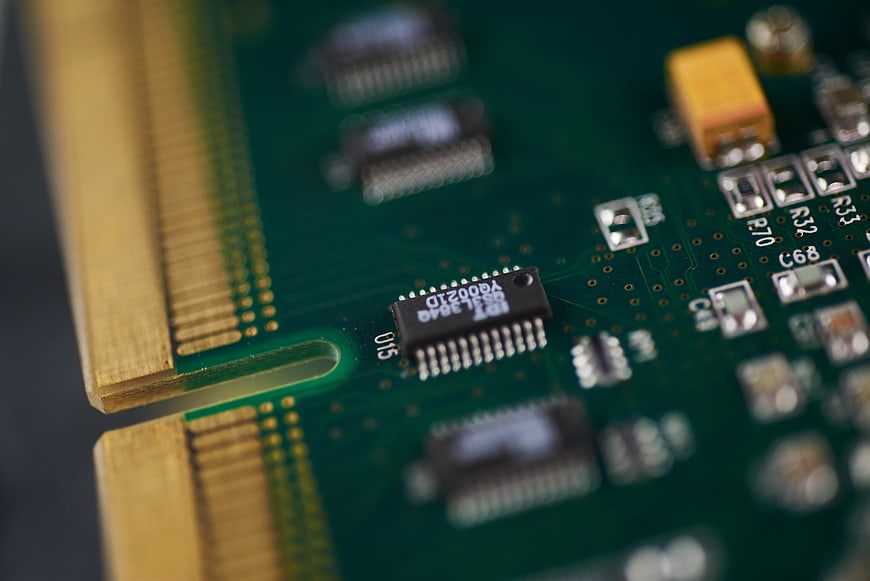 Macro Close-Up of Green Circuit Board with Gold Connectors