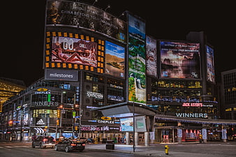 Night view of Dundas Square Toronto with illuminated billboards and city lights