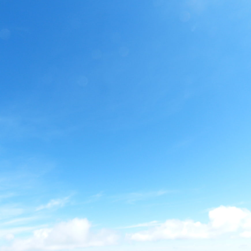 Bright Blue Sky with White Clouds Background