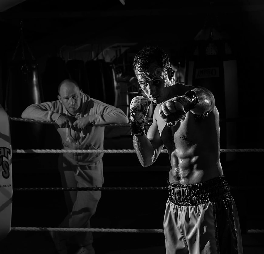 Boxer Training in Ring with Coach