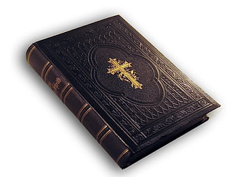 Black leather bible with gold cross on white background