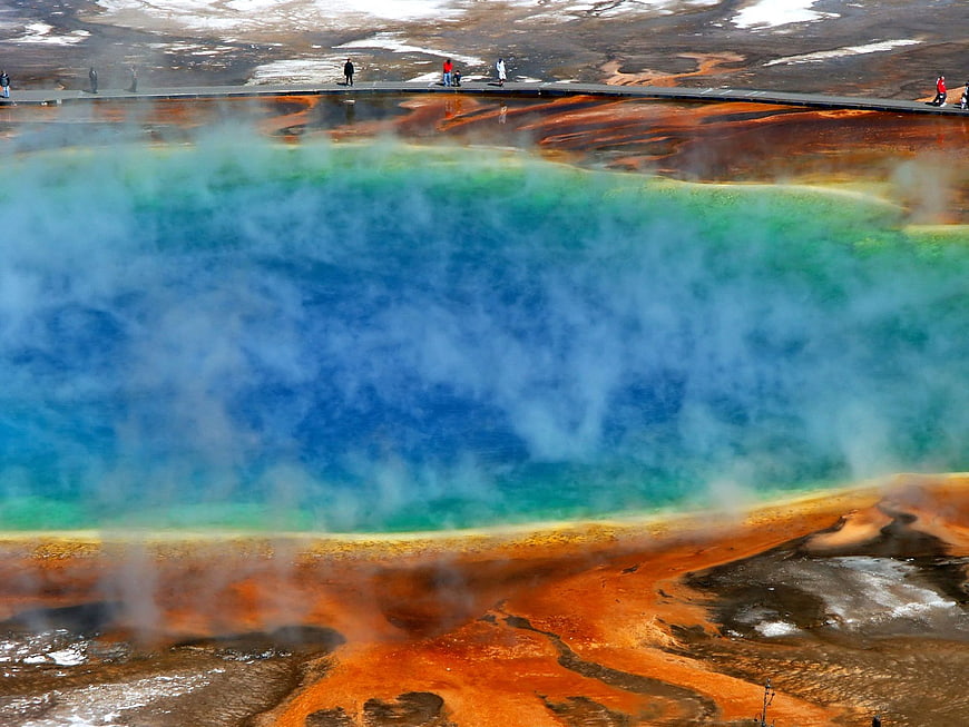 Vibrant Blue Geothermal Hot Spring with Steam and Orange Banks