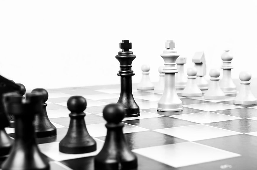 Black and White Chess Pieces on Board with Shallow Depth of Field