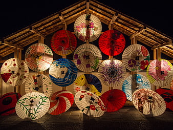 Illuminated Japanese Paper Umbrellas Display at Night