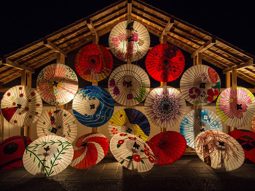 Illuminated Japanese Paper Umbrellas Display at Night
