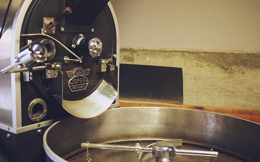 Close-up of Joper coffee roasting machine in industrial setting