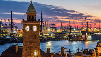 Hamburg Port Clock Tower at Dusk with Industrial Cranes and Elbe River