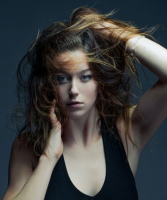 Portrait of Woman with Messy Hair and Intense Gaze