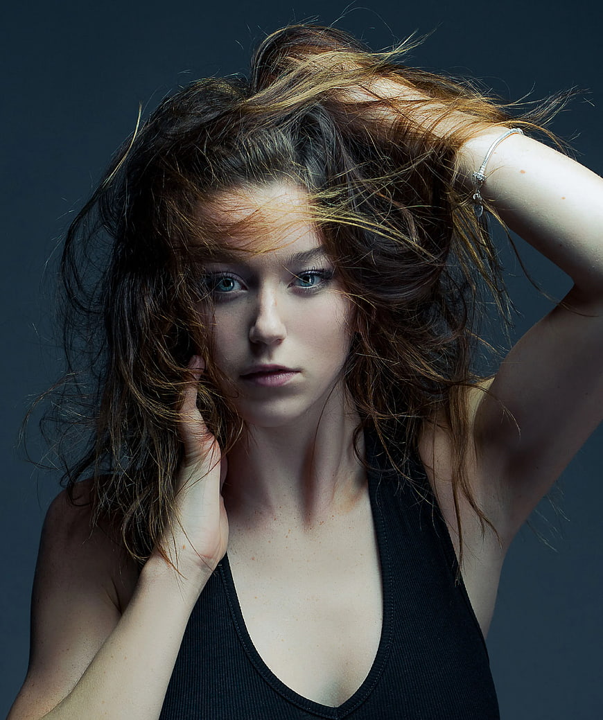 Portrait of Woman with Messy Hair and Intense Gaze