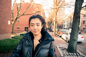 Asian Woman Portrait on City Street in Winter Sunlight