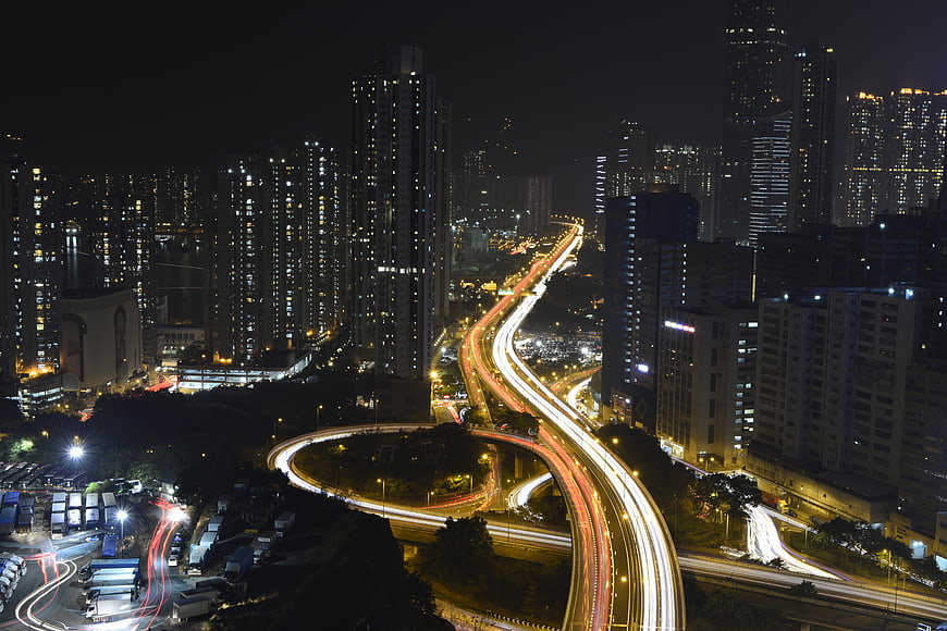 Hong Kong Night Cityscape With Highway Light Trails
