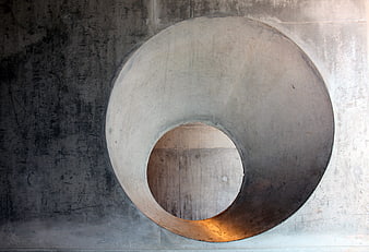 Abstract Concrete Wall with Circular Opening and Texture