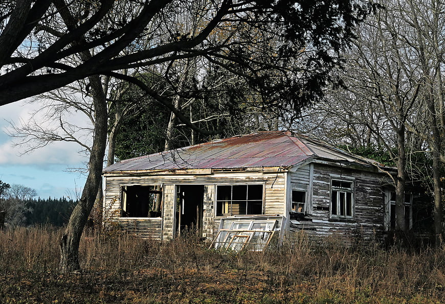 Abandoned Weathered Wooden House in Rural Forest