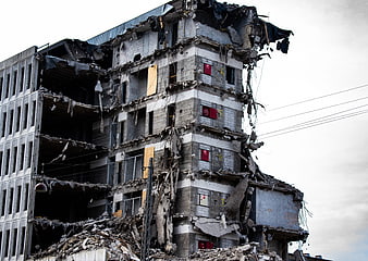Severely Damaged Multi-Story Concrete Building Ruins