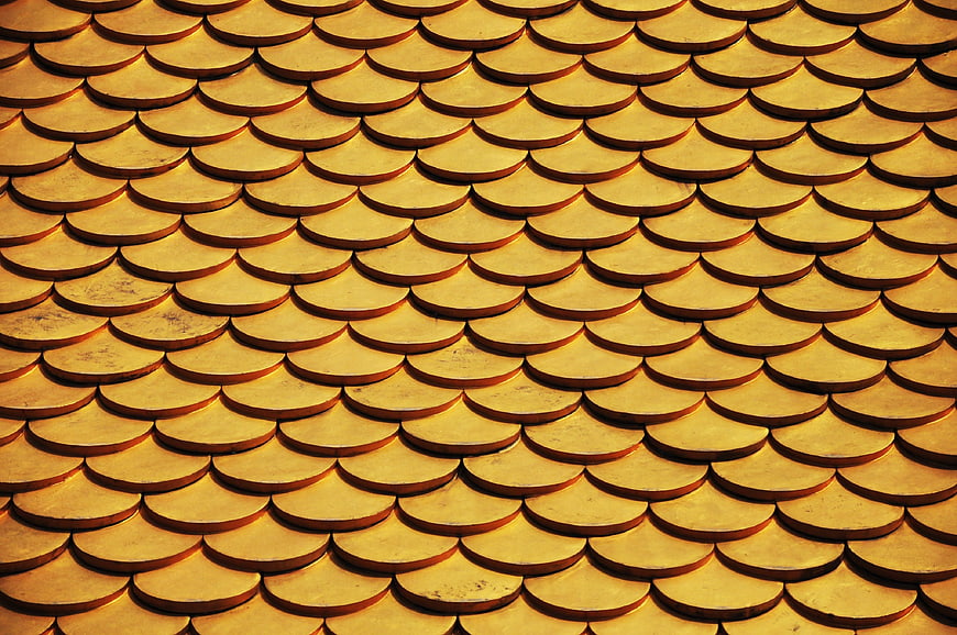 Golden overlapping scale pattern texture background