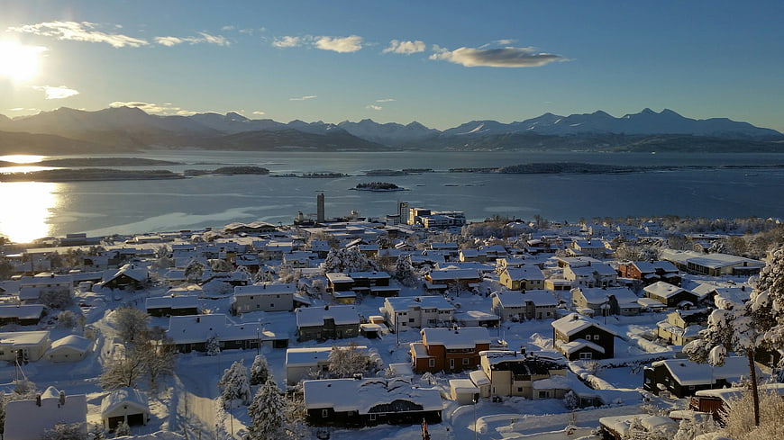 Aerial View of Snow-Covered Norwegian Town and Fjord