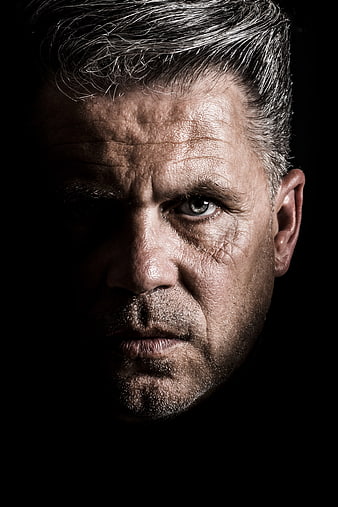 Dramatic Close-Up Portrait of Serious Mature Man