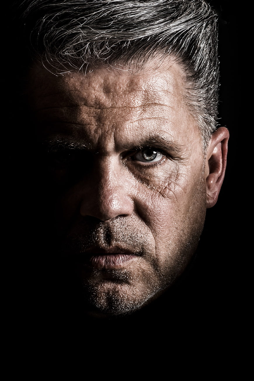 Dramatic Close-Up Portrait of Serious Mature Man