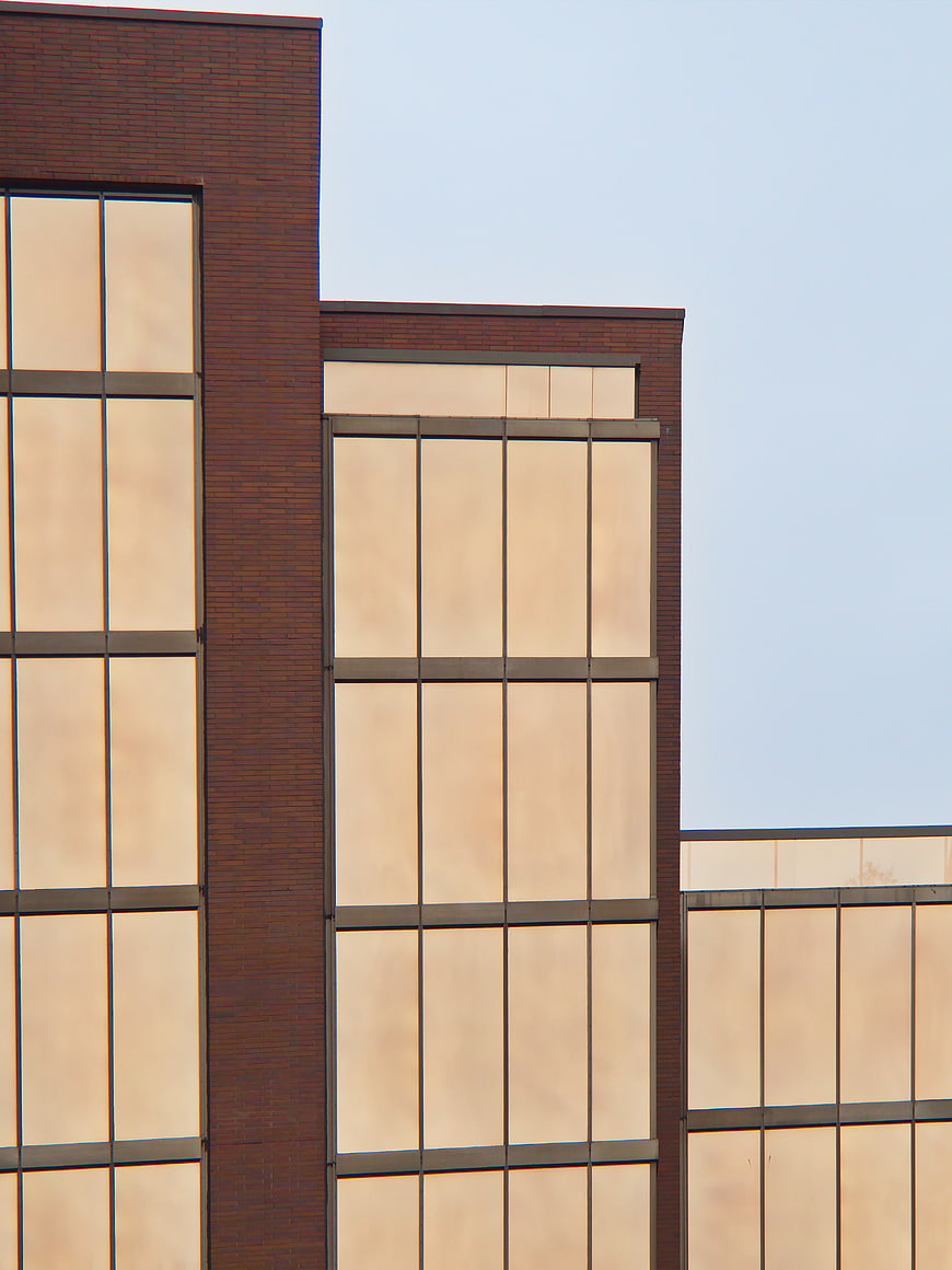Modern Brick Building Facade with Geometric Windows