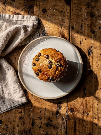 Chocolate Chip Muffin on Rustic Wooden Table