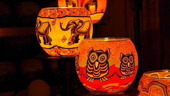 Hand-painted glass candle holders with owl and elephant designs