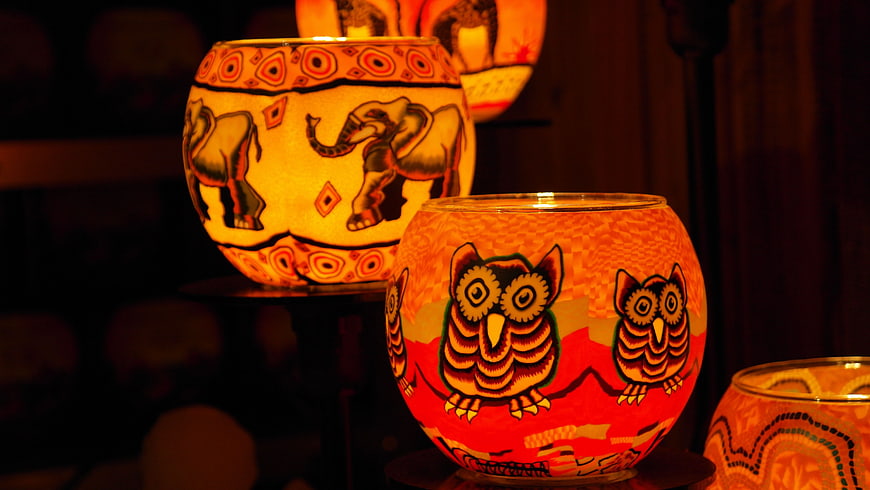 Hand-painted glass candle holders with owl and elephant designs