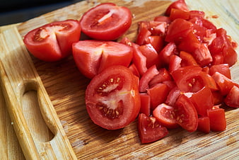 Fresh Chopped Tomatoes on Wooden Cutting Board
