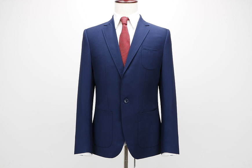 Navy Blue Men's Suit Jacket With Red Tie On Mannequin