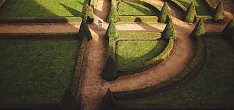 Aerial View of Formal Garden with Geometric Hedges and Paths