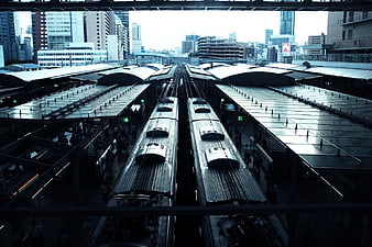 Overhead View of Two Trains at Urban Railway Station