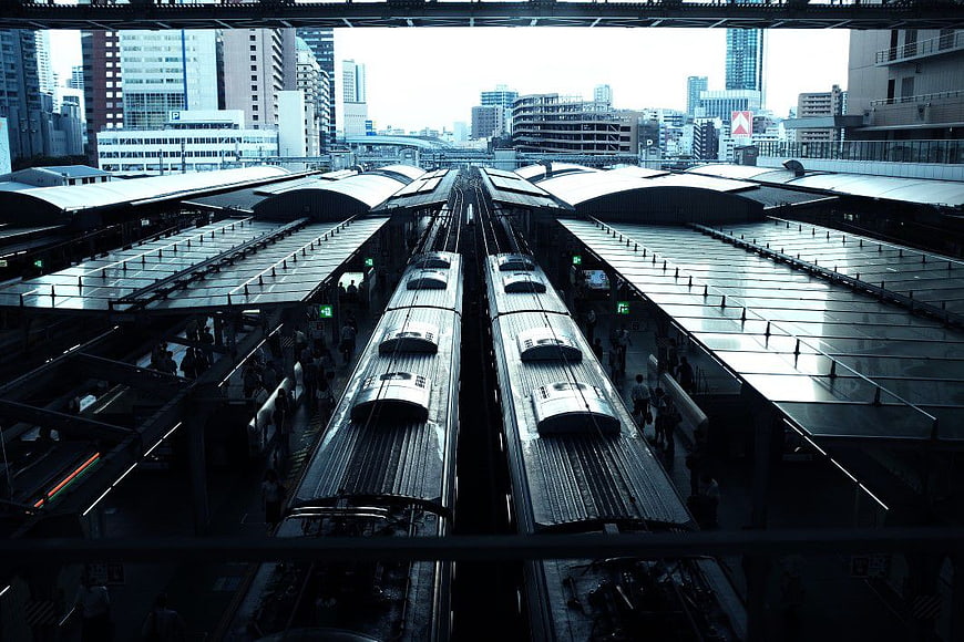 Overhead View of Two Trains at Urban Railway Station